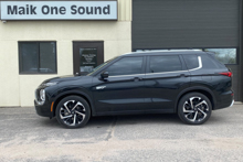 Black 2024 Mitsubishi Outlander PHEV in winter with premium window film